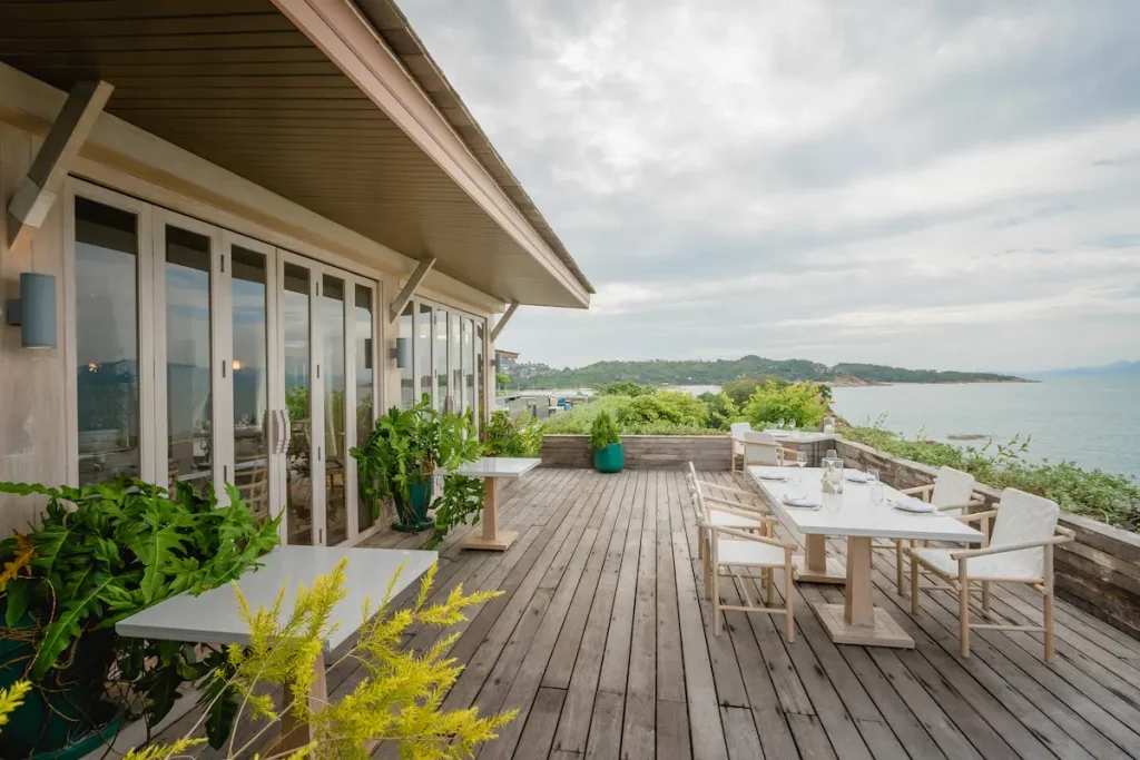 Al fresco dining area with a sea view at Long Dtai Restaurant